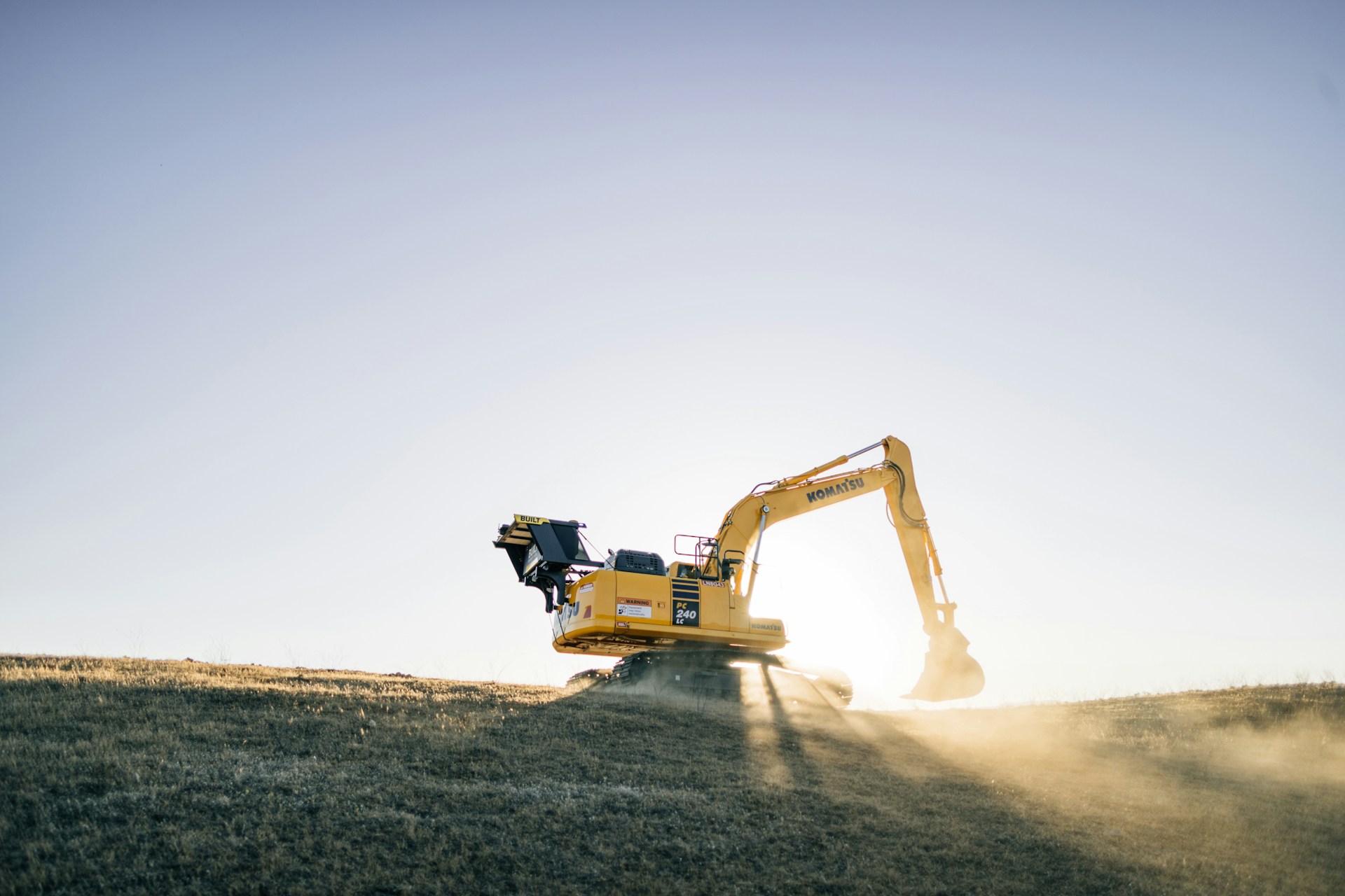 Excavator at sunset on construction site