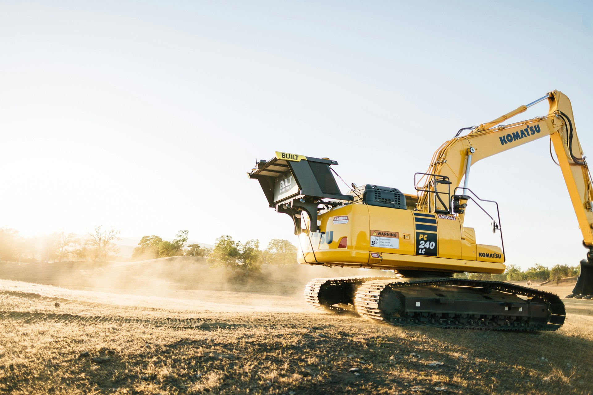 Construction excavator operating on site